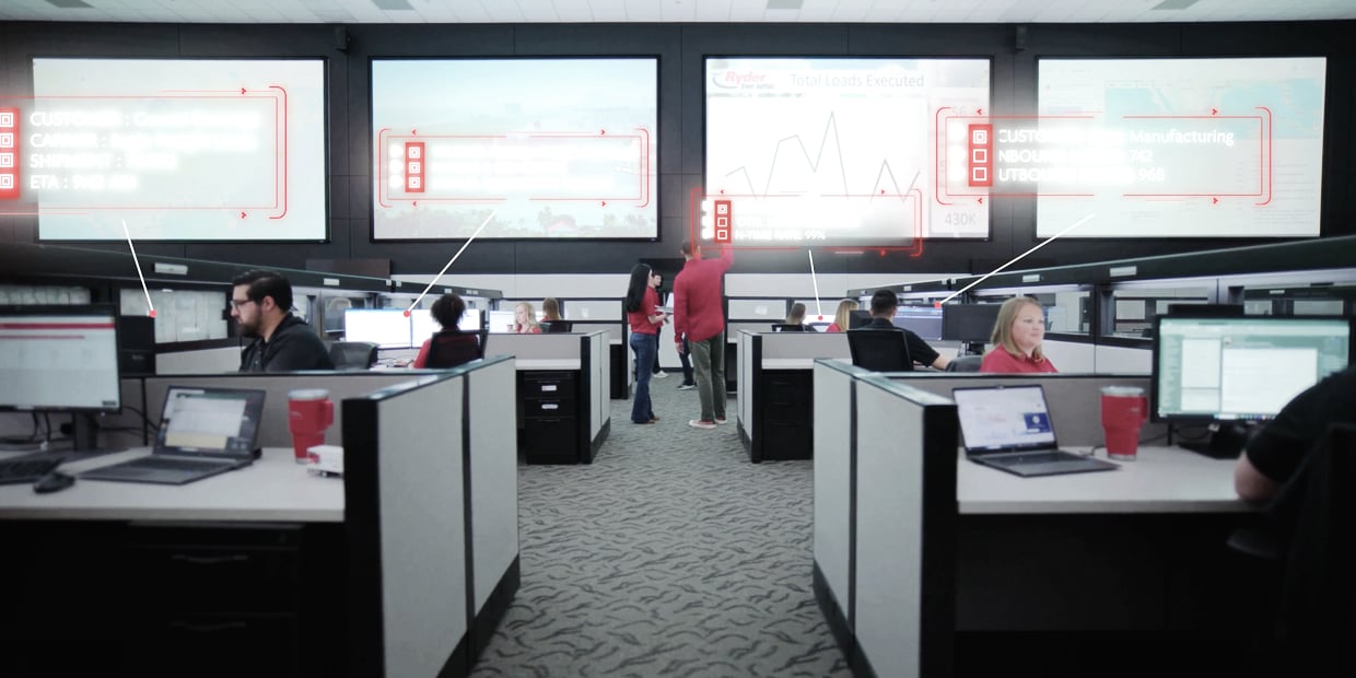Ryder transportation management team monitoring freight in a logistics control center Ryder transportation management team monitoring freight in a logistics control center