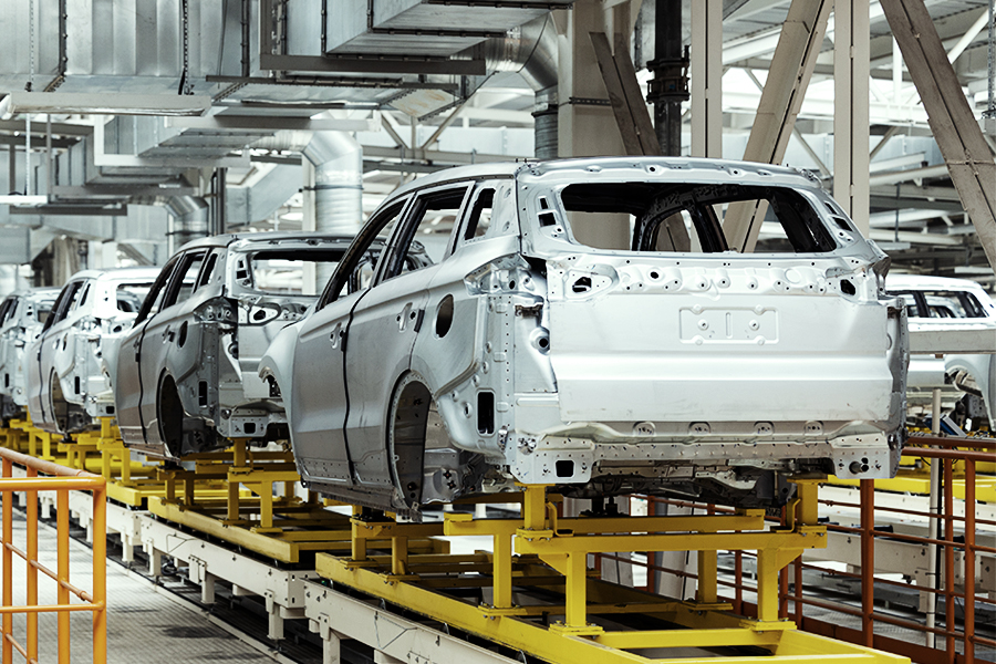 Cars being put together on an assembly line