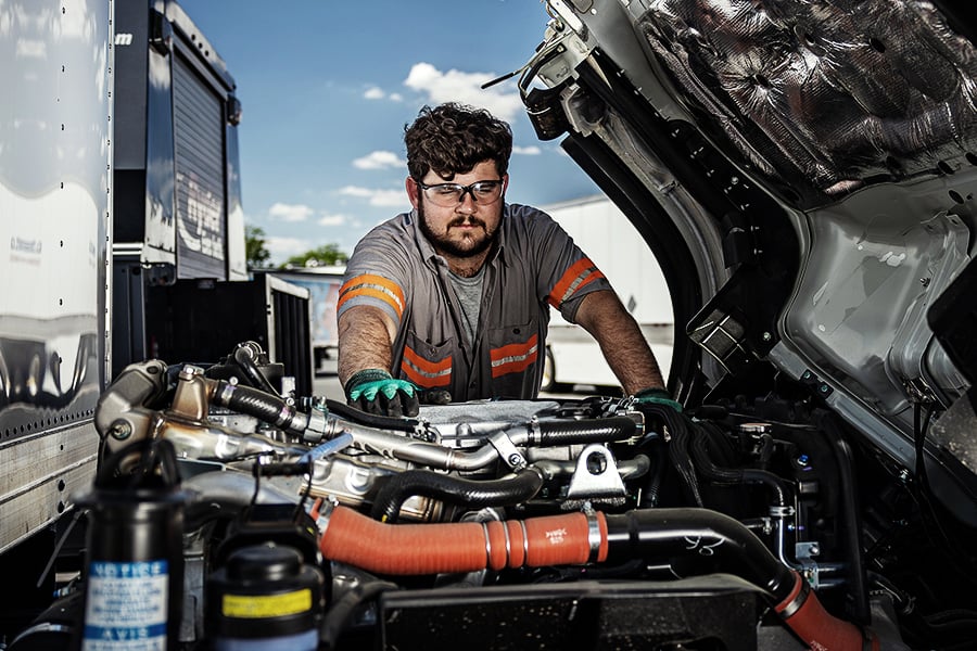 A Ryder mechanic performing on-site maintenance on a customer's semi-truck A Ryder mechanic performing on-site maintenance on a customer's semi-truck