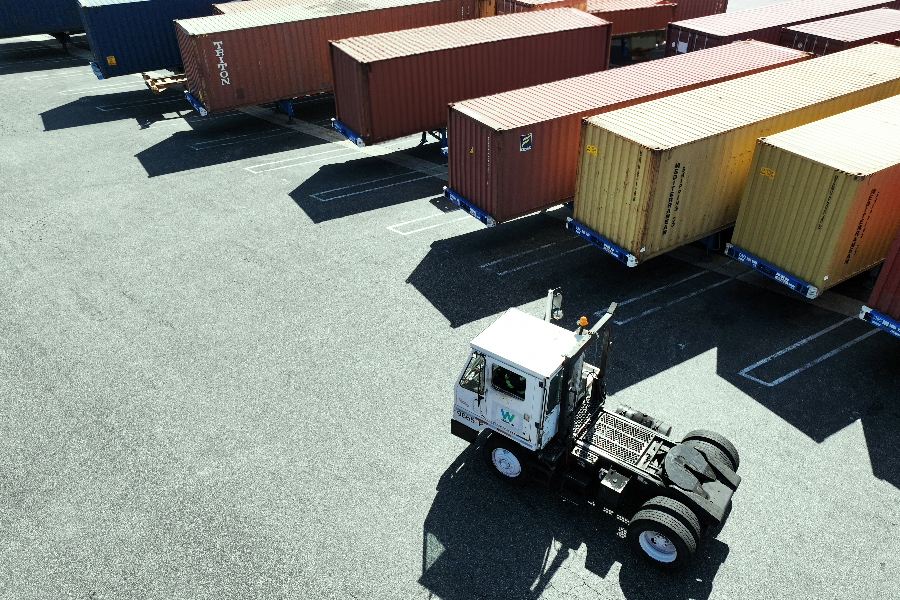 Truck driving through a cross border shipping yard