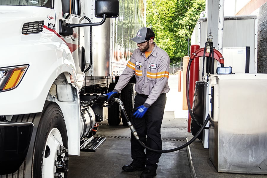 A Ryder technician filling up a semi truck A Ryder technician filling up a semi truck
