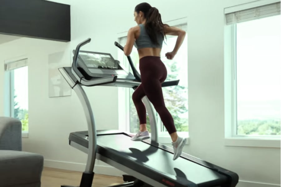 woman running on nordictrack treadmill delivered by Ryder final mile carrier