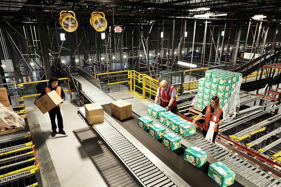 Conveyor and sortation system routing packages through a warehouse Conveyor and sortation system routing packages through a warehouse