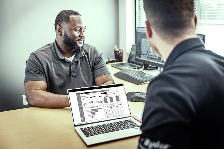 Two Ryder employees using Ryderview to track deliveries Two Ryder employees using Ryderview to track deliveries