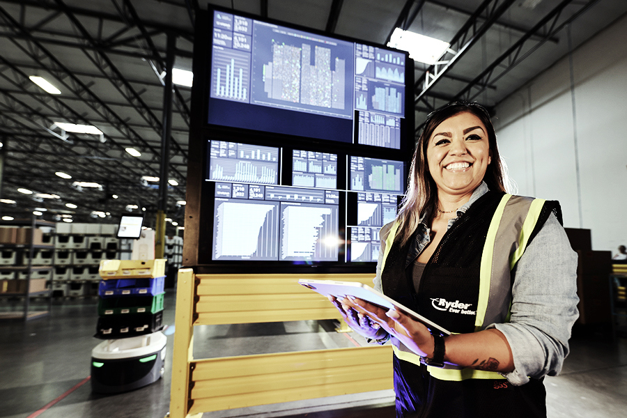 A Ryder employee utilizing Ryder technology and automation A Ryder employee utilizing Ryder technology and automation