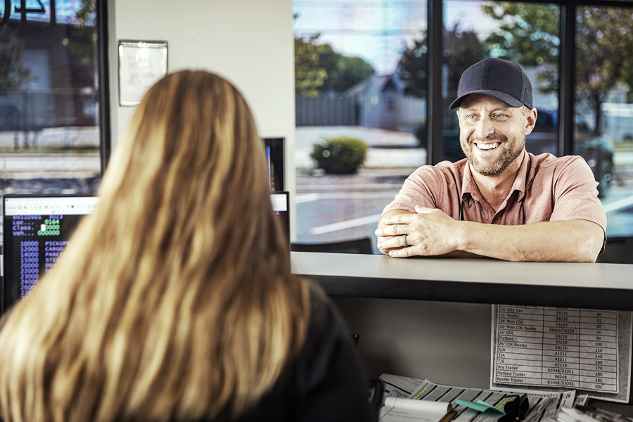 A ryder employee going over the benefits of Rydergyde to a Ryder rental customer A ryder employee going over the benefits of Rydergyde to a Ryder rental customer