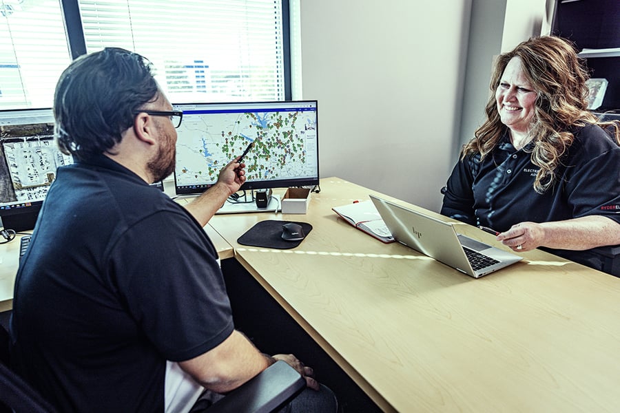 A ryder employee going over the benefits of Rydergyde to a truck lease and maintenance customer A ryder employee going over the benefits of Rydergyde to a truck lease and maintenance customer