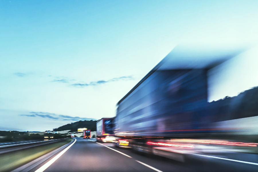 freight trucks driving on the road