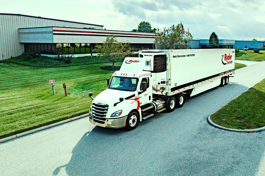 truck carrying specialized freight driving on road