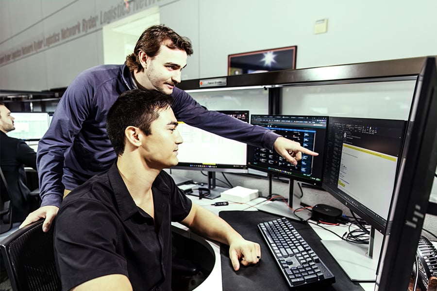 two Ryder transportation management employees working together two Ryder transportation management employees working together