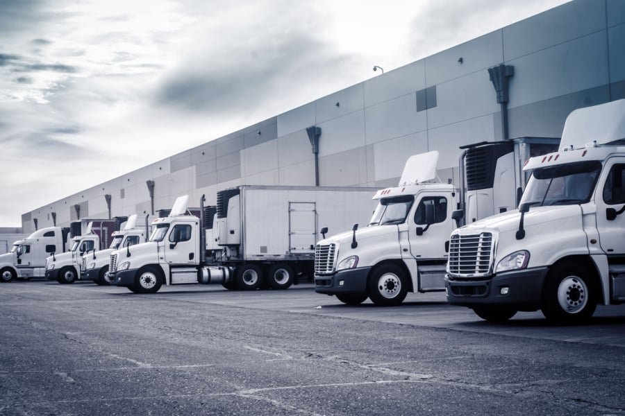 Freight truck carriers at warehouse loading docks