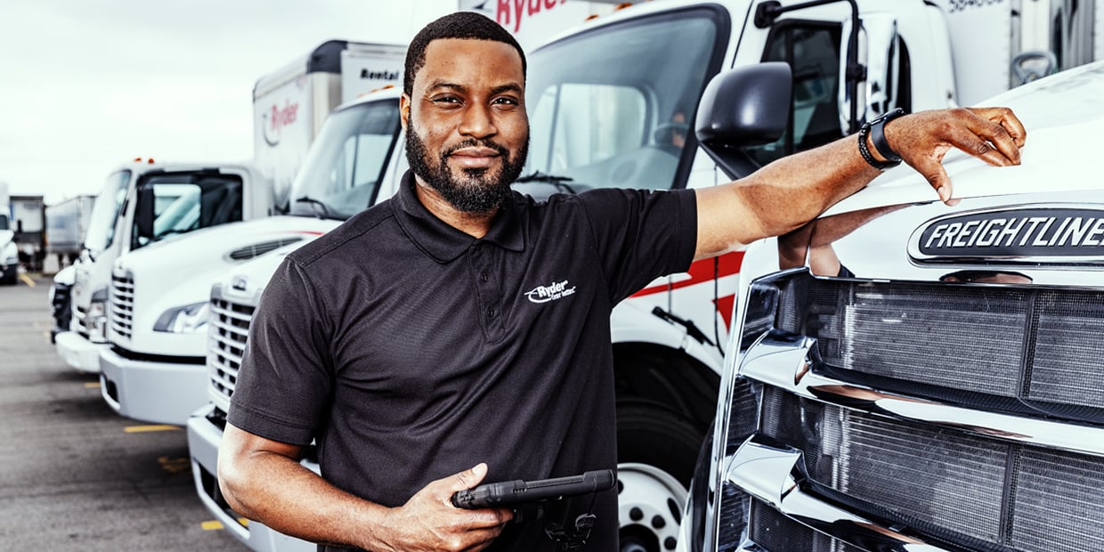 Truck Leasing TCO Ryder truck driver in front of his truck