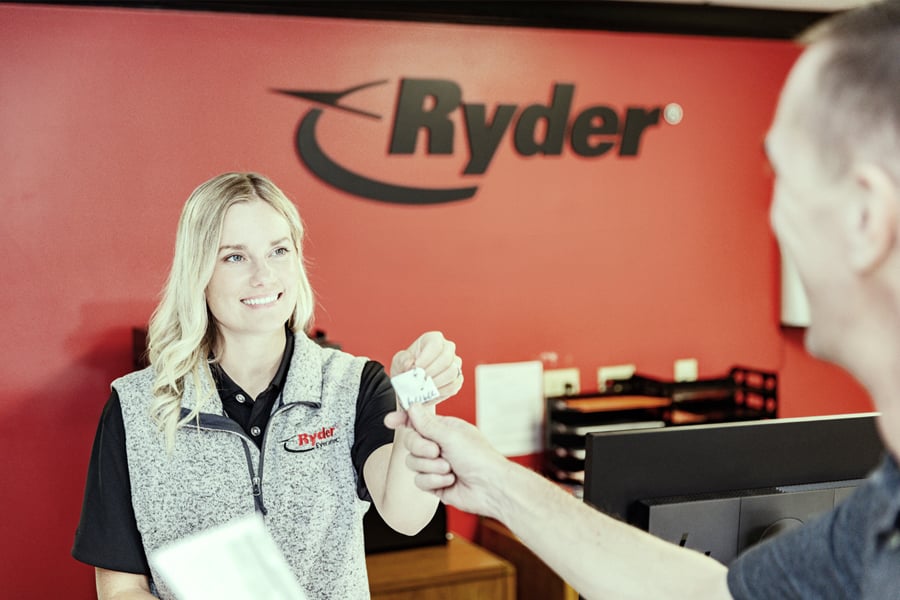 Ryder rental agent passing off truck keys to a customer Ryder rental agent passing off truck keys to a customer
