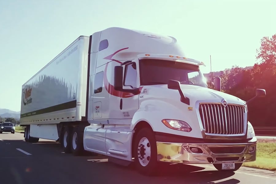 Video showcasing Ryder tandem axle sleeper tractor-trailer delivering goods Video showcasing Ryder tandem axle sleeper tractor-trailer delivering goods